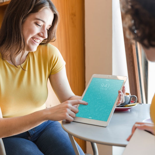 Free Couple With Tablet Mockup In Library Psd