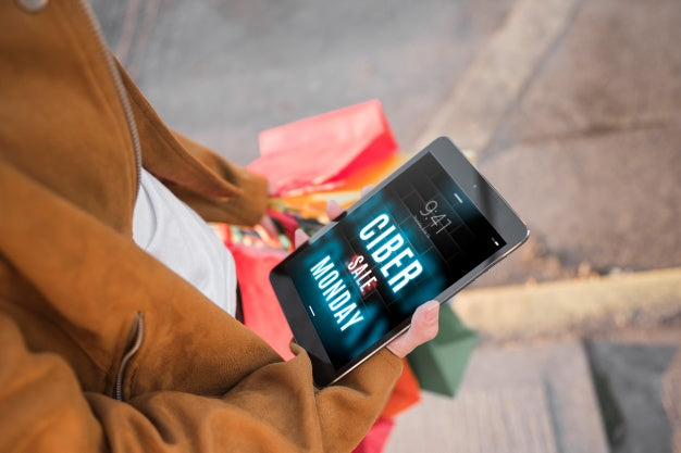 Free Cyber Monday Mockup With Woman Holding Tablet Psd