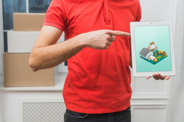 Free Delivery Mockup With Man Holding Tablet Psd