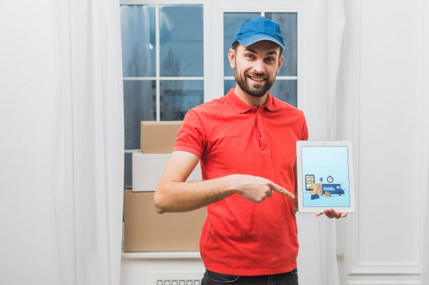 Free Delivery Mockup With Man Holding Tablet Psd