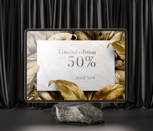 Free Digital Tablet With Golden Leaves On A Marble Psd