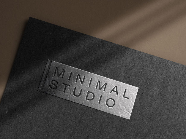 Free Embossed Silver Logo Mockup On Dark Paper Psd