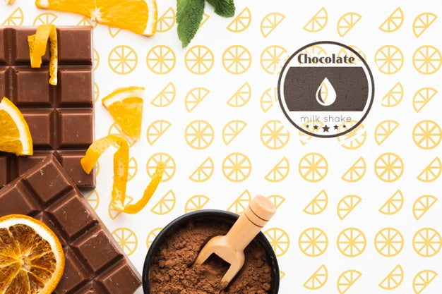 Free Flat Lay Chocolate With Orange Background Mock-Up Psd