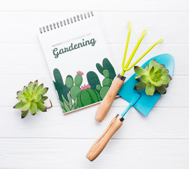 Free Flat Lay Notebook And Blue Shovel Psd