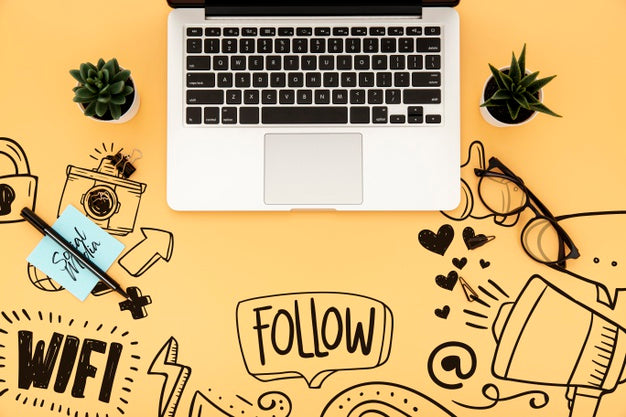 Free Flat Lay Of Desk Surface With Laptop And Plants Psd