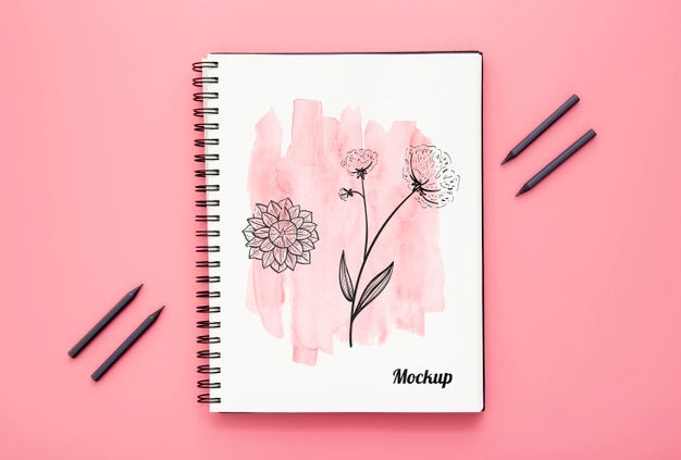 Free Flat Lay Of Desk Surface With Notebook And Pencils Psd