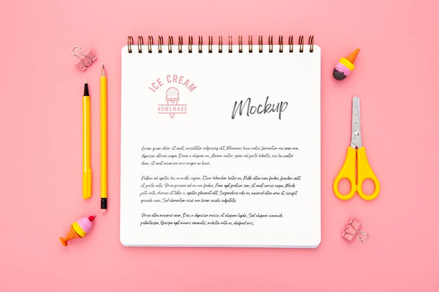 Free Flat Lay Of Desk Surface With Notebook And Scissors Psd