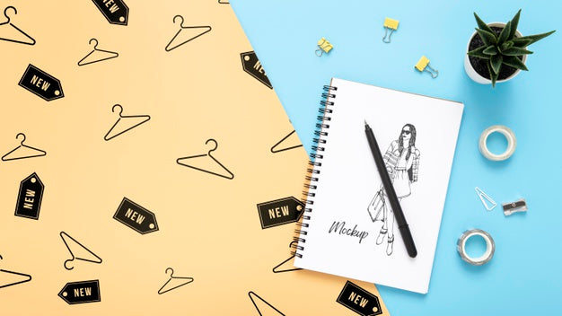 Free Flat Lay Of Desk Surface With Notepad And Pen Psd