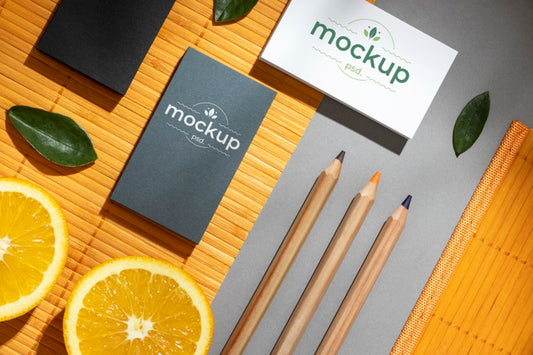 Free Flat Lay Of Paper Stationery With Citrus And Pencils Psd