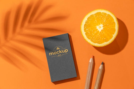 Free Flat Lay Of Paper Stationery With Pencils And Citrus Psd