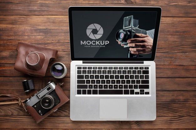 Free Flat Lay Of Photographer Wooden Workspace With Laptop Psd