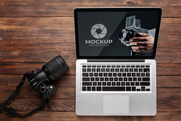 Free Flat Lay Of Photographer Wooden Workspace With Laptop Psd