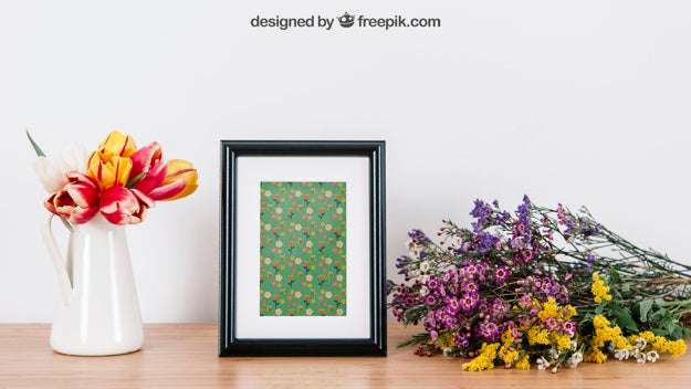 Free Floral Mockup Of Frame On Desk Psd