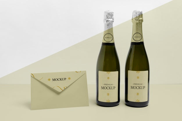 Free Front View Envelope And Champagne Bottles Mock-Up Psd