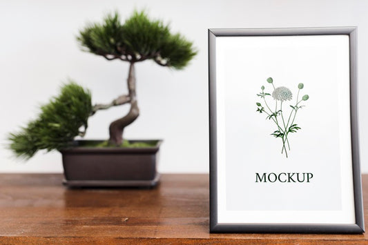 Free Front View Of Frame And Bonsai For Home Interior Psd