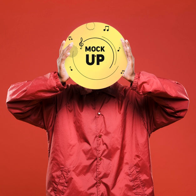 Free Front View Of Man Holding Vinyl Disk Over His Face For Music Store Mock-Up Psd