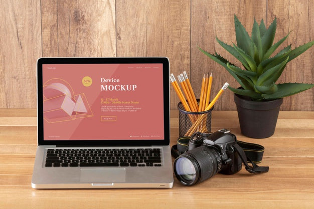 Free Front View Of Photographer Wooden Workspace With Laptop Psd