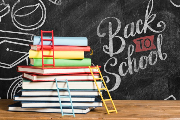 Free Front View Pile Of Books With Chalkboard Psd