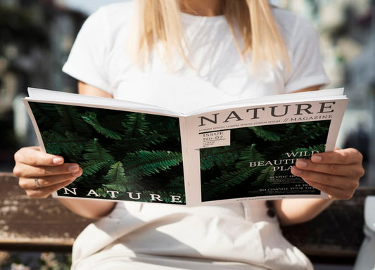 Free Front View Woman Looking Into A Nature Magazine Psd