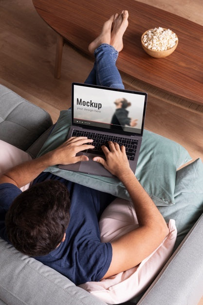 Free Full Shot Man Watching Movie On Laptop Psd