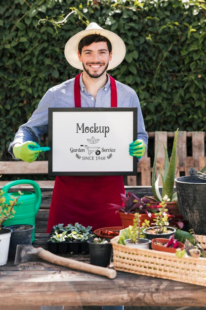 Free Gardener Holding Mock-Up Sign Psd