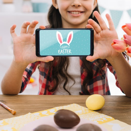 Free Girl With Smartphone Mockup On Easter Day Psd