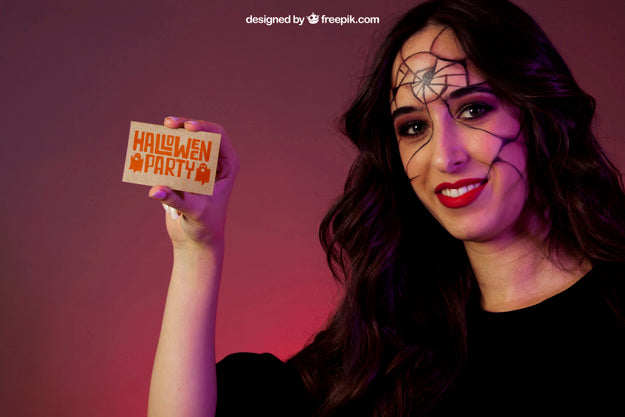 Free Halloween Mockup With Girl Showing Business Card Psd