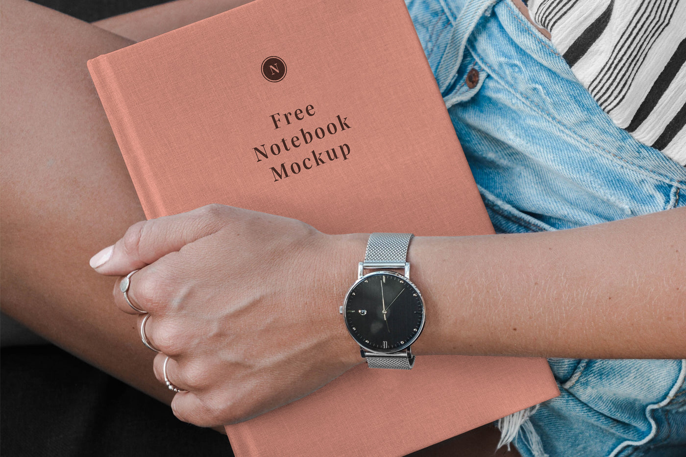 Free Hand Holding Notebook Mockup