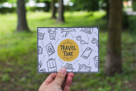 Free Hand Holding Paper In Nature For Travel Concept Psd