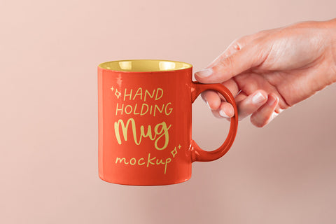 Free Hand Holding Psd Mug Mockup 2