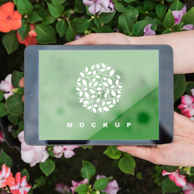 Free Hands Holding Tablet Mockup With Gardening Concept Psd