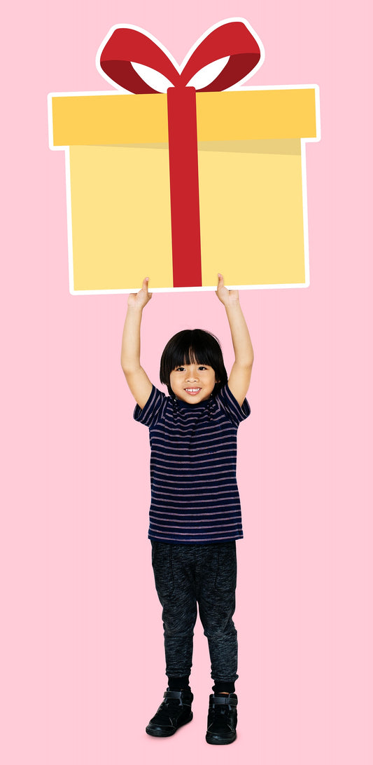 Free Happy Boy Holding A Gift Box