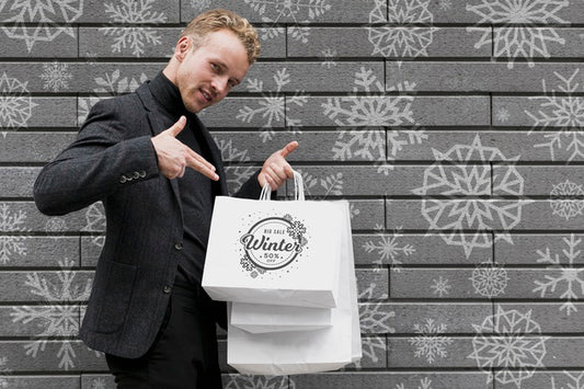 Free Happy Male Pointing At His Shopping Bags Psd