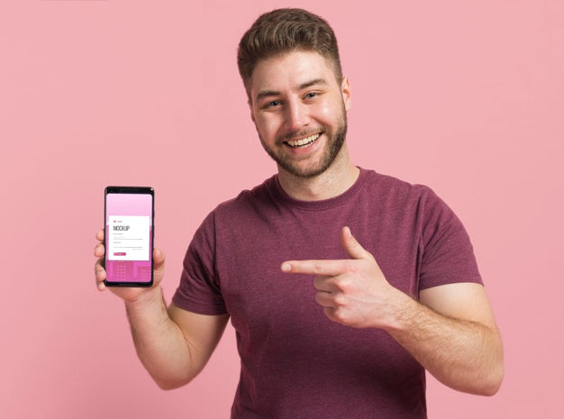 Free Happy Man Showing Smartphone Digital Mock-Up Psd