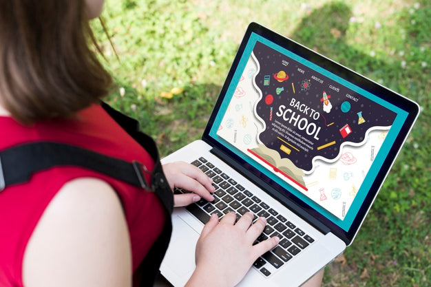 Free High Angle Girl Using Laptop Outside Mock-Up Psd