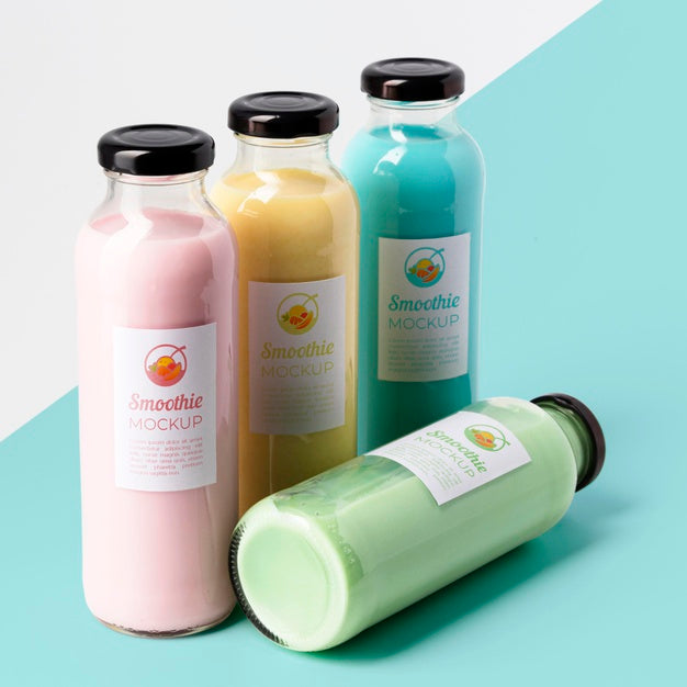 Free High Angle Of Assortment Of Clear Juice Bottles With Caps Psd