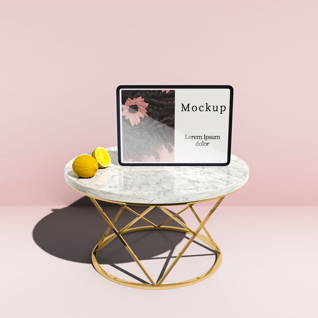 Free High Angle Of Tablet On Table With Lemons Psd