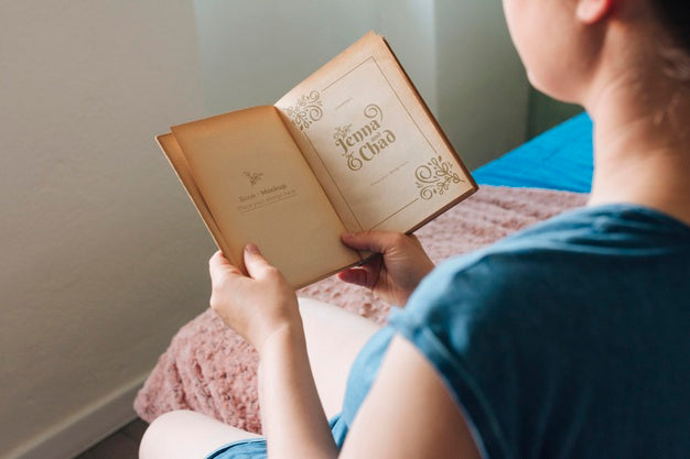 Free High Angle Of Woman Reading A Book Psd