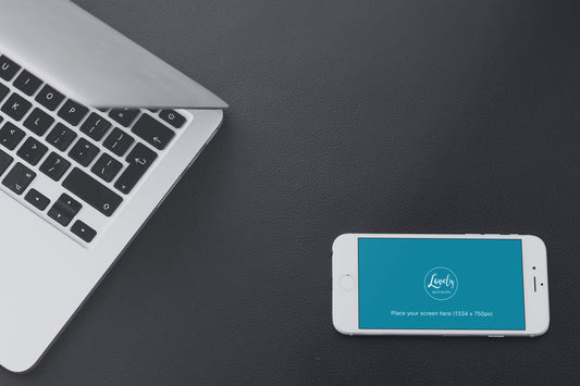 Free iPhone Mockup And Macbook On A Leather Background