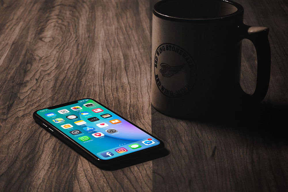 Free iPhone X with Coffee Mug Mockup