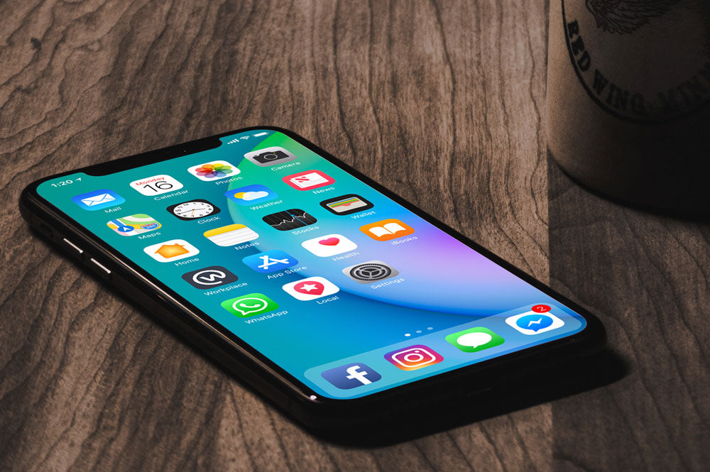 Free iPhone X with Coffee Mug Mockup