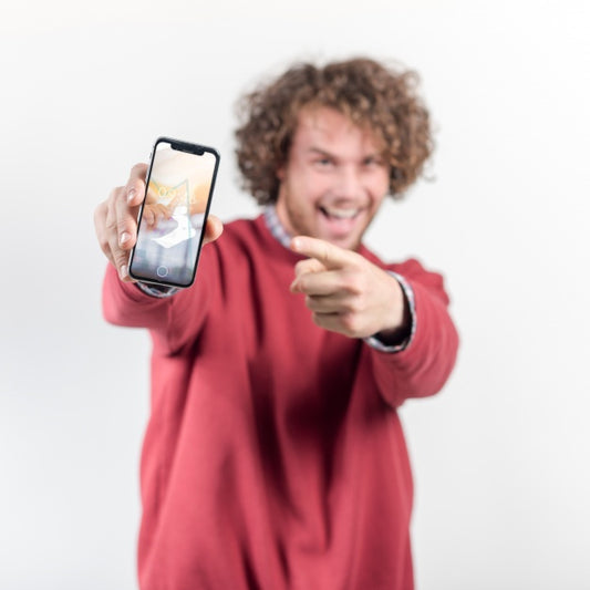 Free Joyful Man Holding Smartphone Mockup Psd