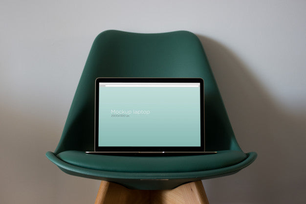 Free Laptop Mockup On Chair Psd