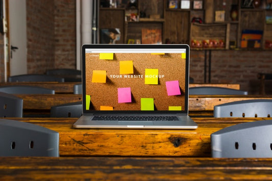 Free Laptop Mockup On Wooden Table Psd