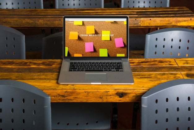 Free Laptop Mockup On Wooden Table Psd