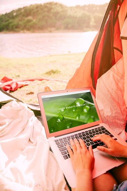 Free Laptop Mockup With Camping In Nature Concept Psd