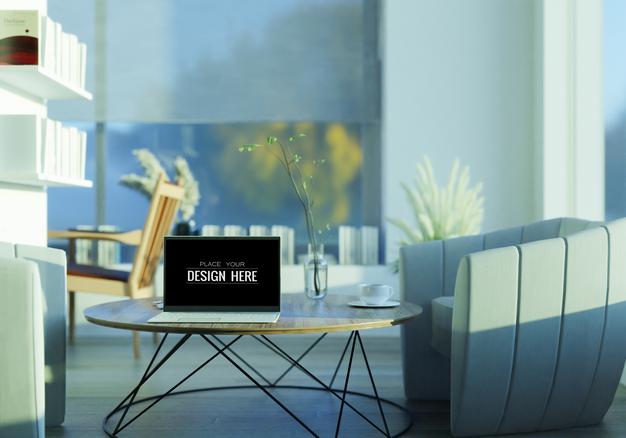 Free Laptop On Desk In Workspace Mockup Psd