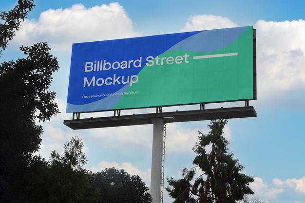 Free Large Billboard Mockup On Blue Sky With Clouds Psd