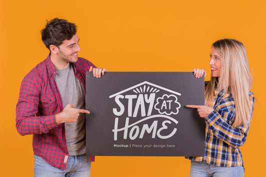 Free Man And Woman Holding A Sign Concept Mock-Up Psd