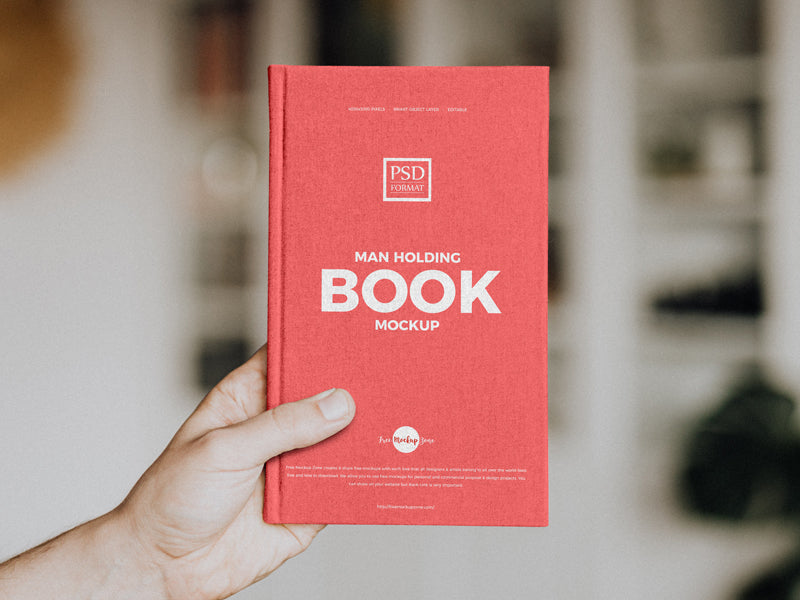 Free Man Holding Book Mockup